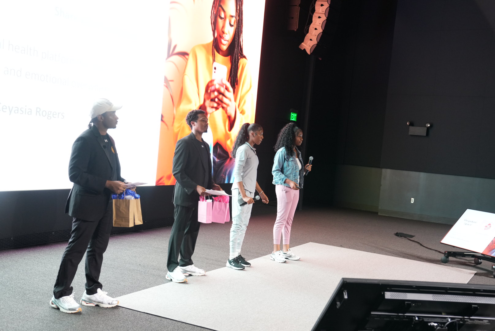 Youth founders and supporters on stage at Youth Pitch Day