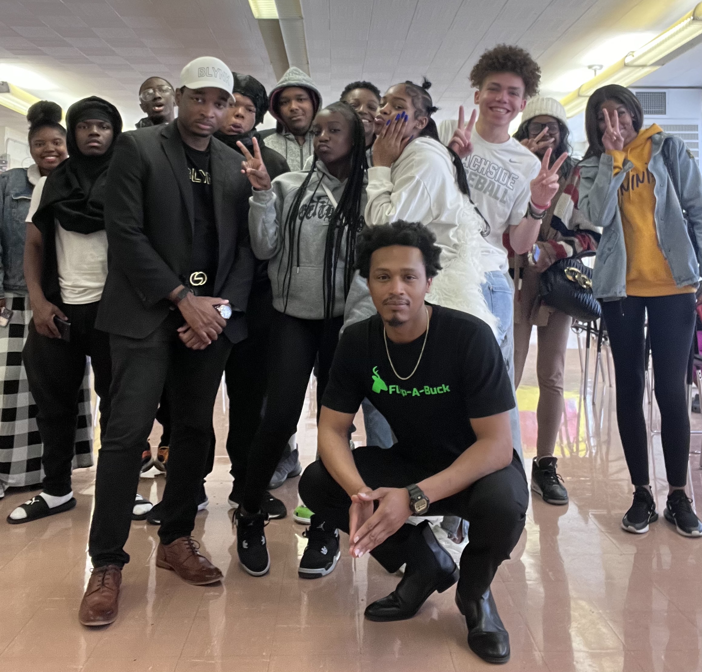 NextGen students and program leaders together in a school