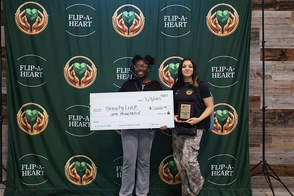 BeautyLink youth founders celebrating their award