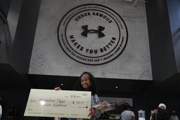 Unspoken Space youth founders receiving their award at Under Armour